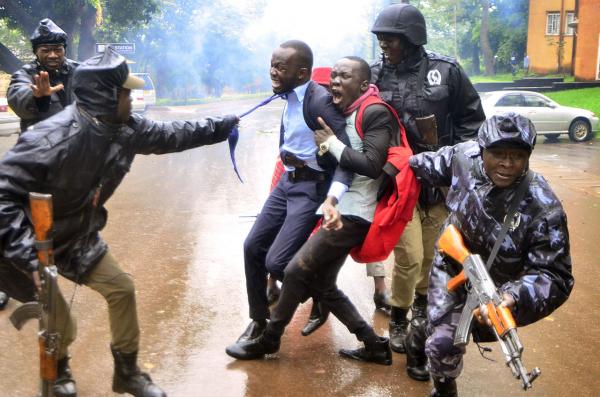  Alex Esagala  1st Place, News  Makerere Student Protests  Police officers arrest Makerere University Guild President Papa Were (in tie) and a colleague at Makerere University during students protests on 16th April 2018. The students were protesting a range of changes to university services including the scrapping of meals in halls of residence, the suspension of evening classes and new hikes in tuition fees at the institution.   