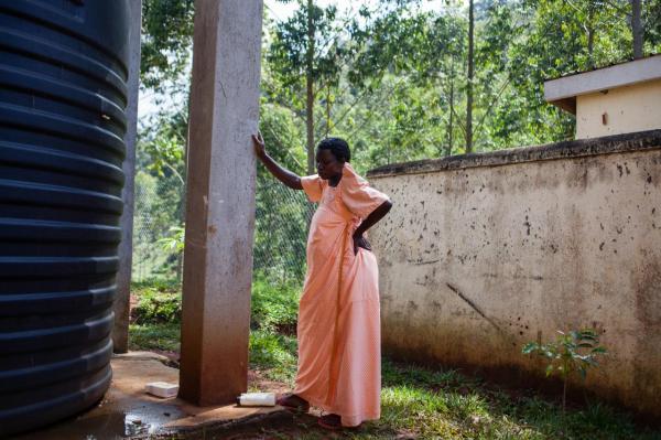 Image from  Esther Mbabazi | The Acquaintance - An expectant woman walks around the health center's...
