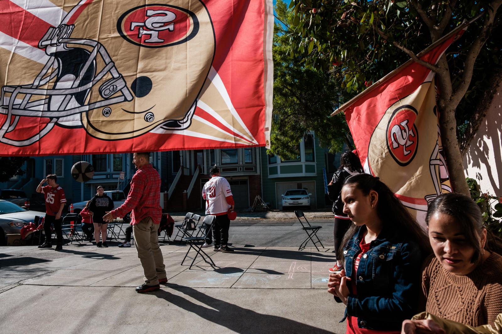 Image from A Scarlet and Gold Neighborhood - Residents and die hard 49er fans hang out on the sidewalk...