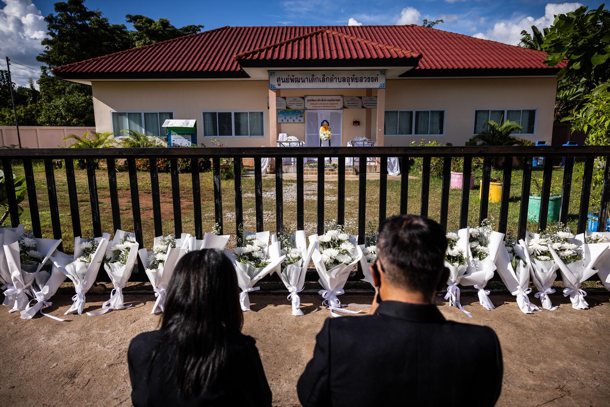 Shooting in Nong Bua Lamphu: The New York Times - Mourners pray at the gates of the day care center, where...