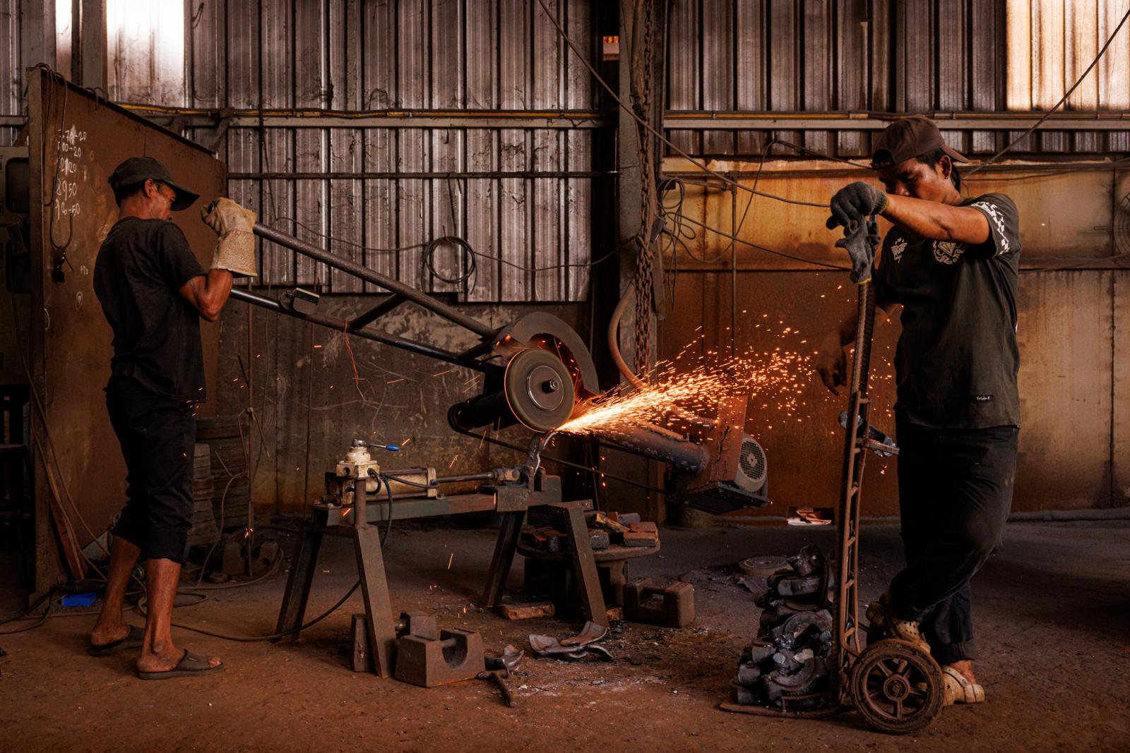 Workers labor in a steel recycl...angkok, Thailand, May 16, 2023.