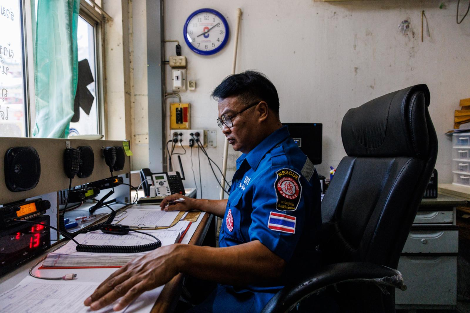 An emergency responder sits at ... Thani, Thailand, June 2, 2023.