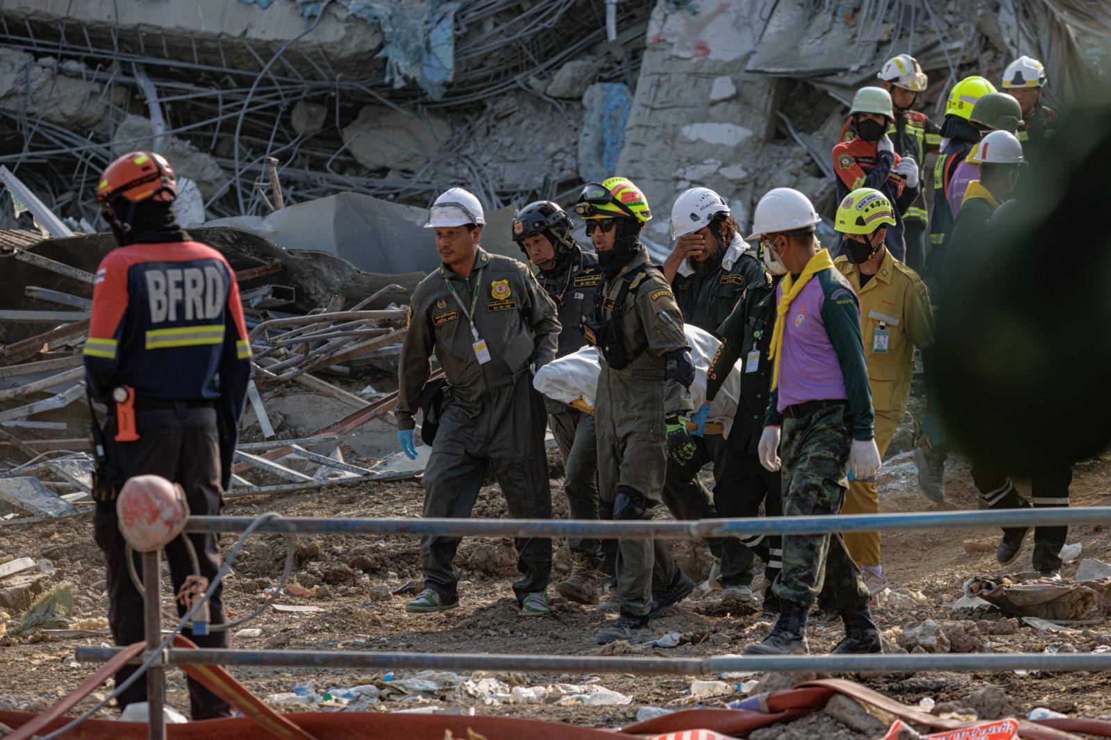 Rescue workers remove a body fr...gkok, Thailand, March 29, 2025.
