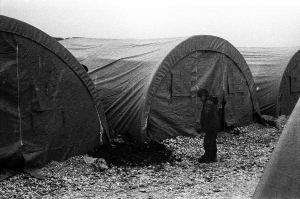 Image from Kobane in Exile - A child searches for his tent in the camp.