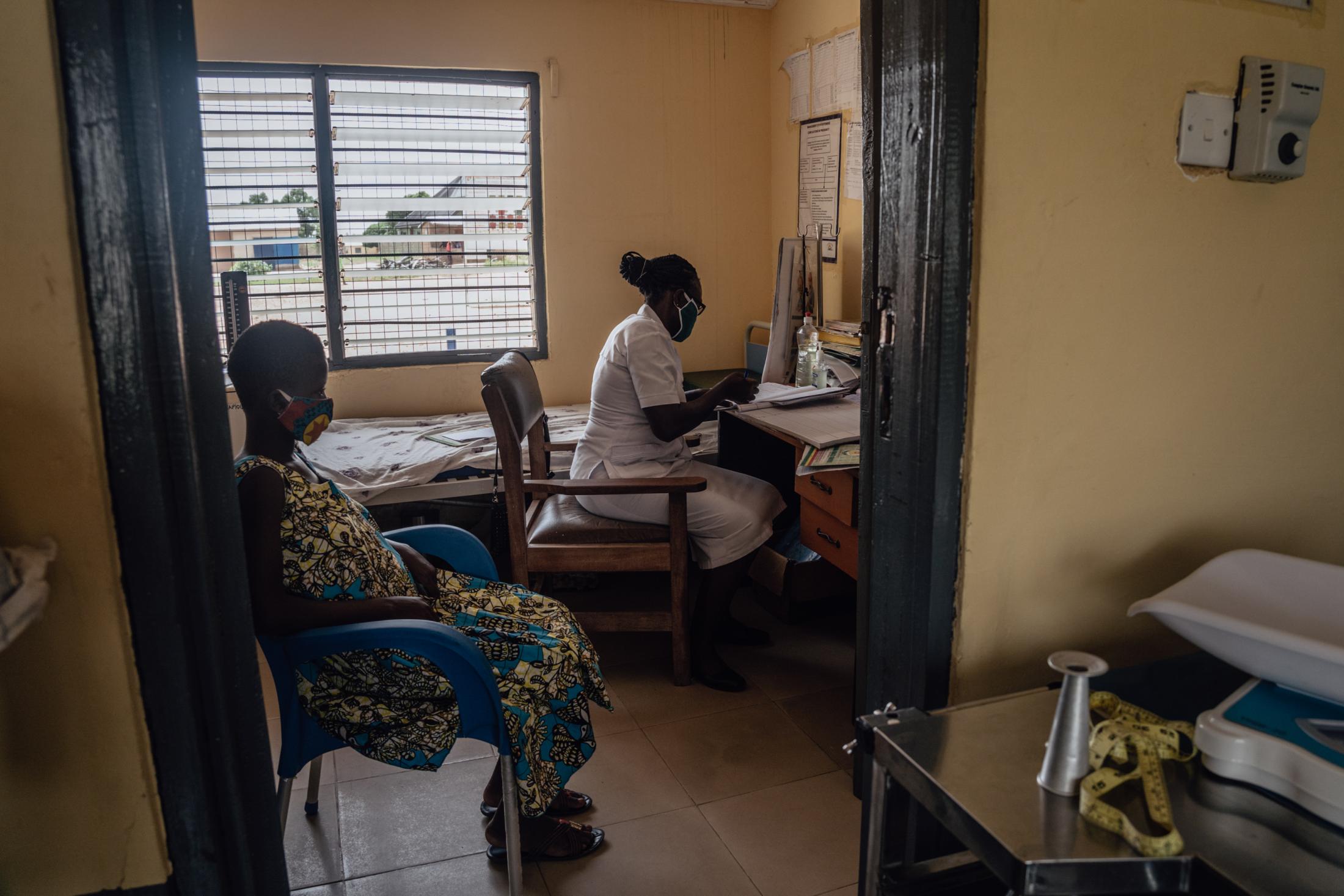 Covid-19 Response in Northern Ghana - Janet Agwiiah Midwife at Winkongo CHPS attends to...