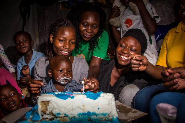 Brian Otieno | Kibera Stories - Prince Adrian, surrounded by families and friends...