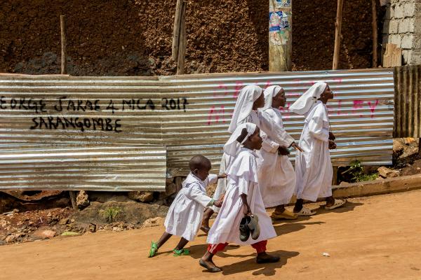 Brian Otieno | Kibera Stories - Children from the Legio Maria head to church wearing...
