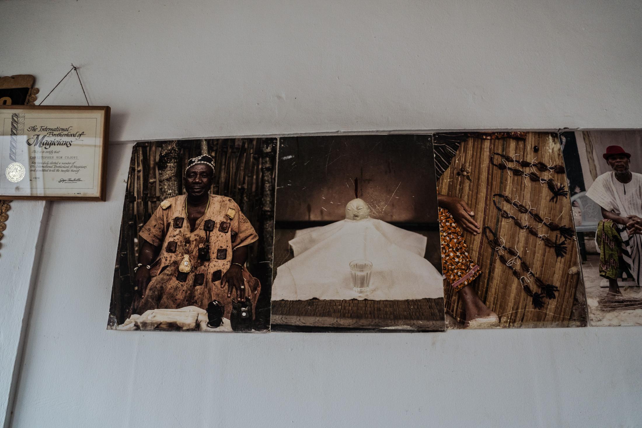 Spirituality and Herbal Medicine in Ghana During Covid-19 Pandemic - Photographs and certificates on the walls of...