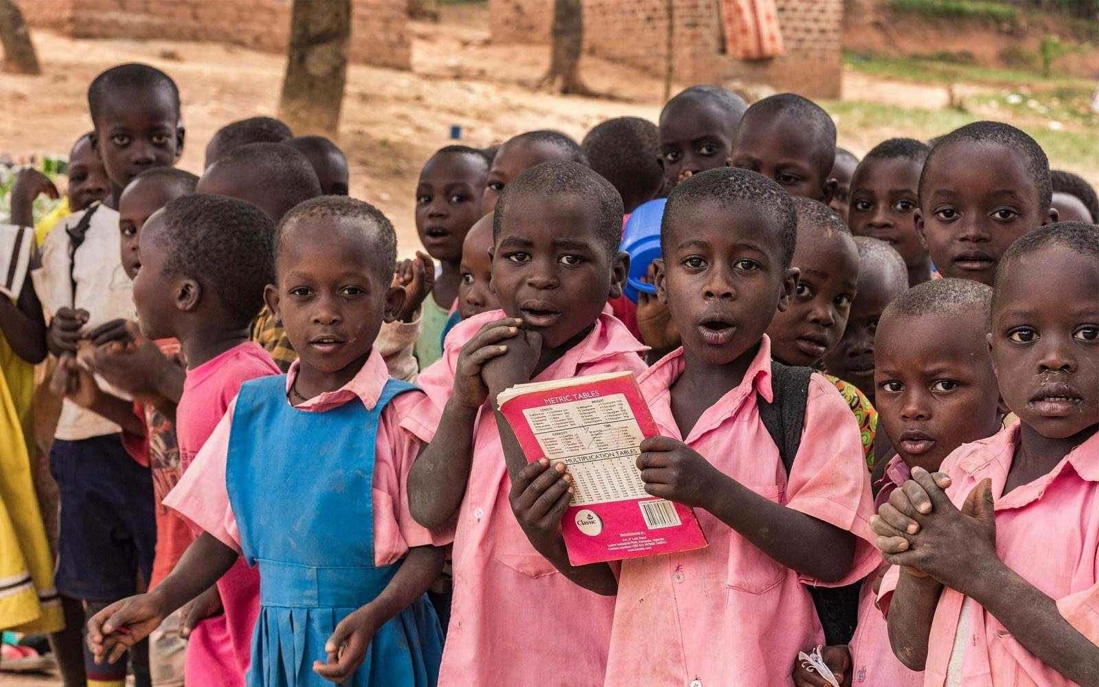 Children during a class under a tree