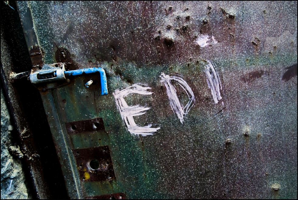 KALMET, ALBANIA. Ediâ€™name wri...the entrance gate of his house.