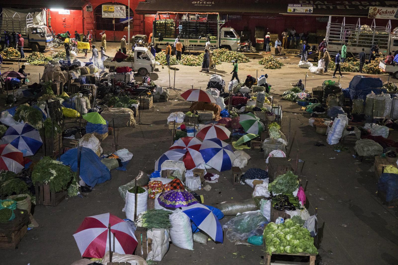 Traders sleeping at a market fo... the spread of the coronavirus.