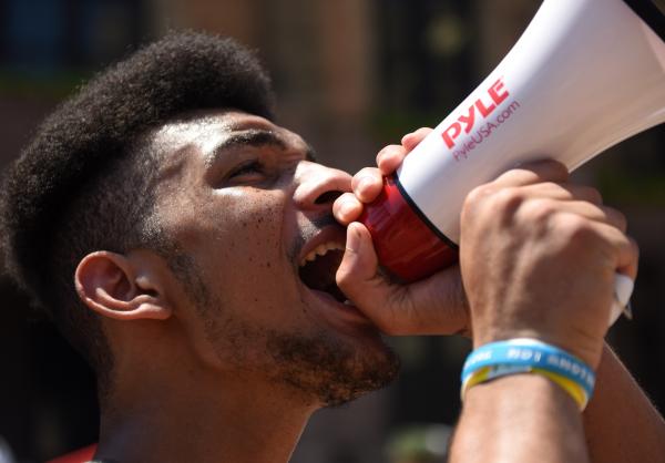 Elijah Foggy, 19, yells into a megaphone at the Protest Against Police Murder on Sunday, June 7, 2020, at St. Louis City Hall. The protest was organized by a group of students and included hundreds of participants to walk from City Hall to the St. Louis Police Headquarters. &quot;This is a young people&#39;s movement,&quot; said Foggy. &quot;Our voices will be heard.&quot;