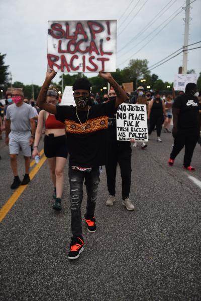 Protestors walk down Lindberg Blvd. on Monday, June 8, 2020, in Florissant, Missouri. Nearly 100 demonstrators walked the steets of Florissant chanting and holding intersections.