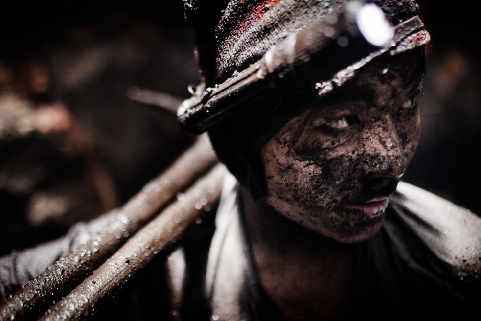 A young coal miner seen in a qu...ne by minors as young as seven.