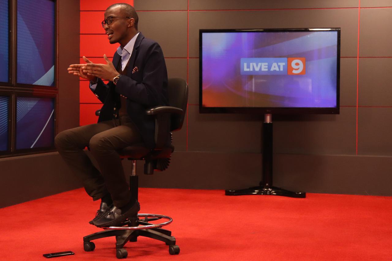 Senior investigative journalist Raymond Mujuni gestures emphatically during a segment about the station&rsquo;s &ldquo;Fake News&rdquo; campaign during a recording.
