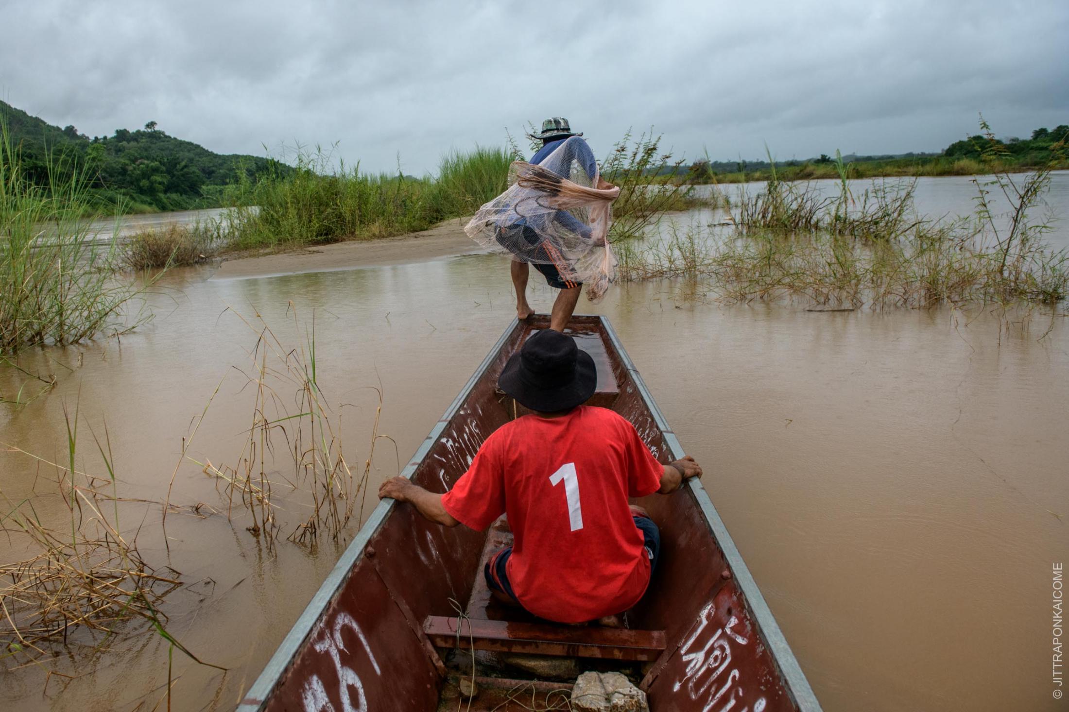 Mekong in Peril - Fishermen are out fishing on the unusually low waters of...