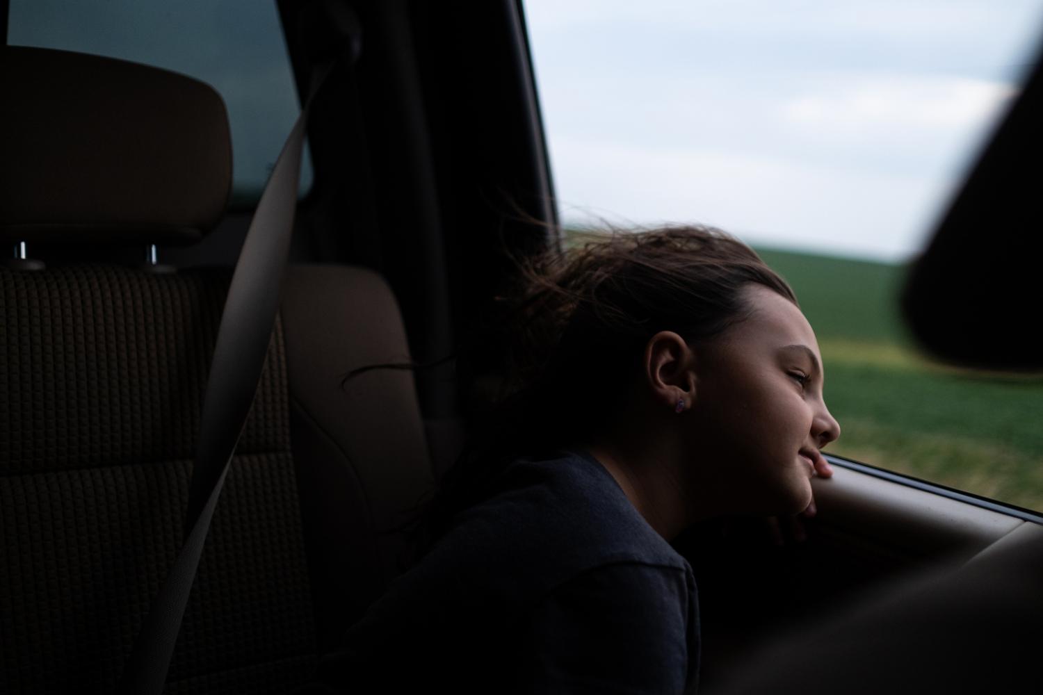 Image from Corn Belt Territory - My niece, Jacey, watches out the window as we drive from...
