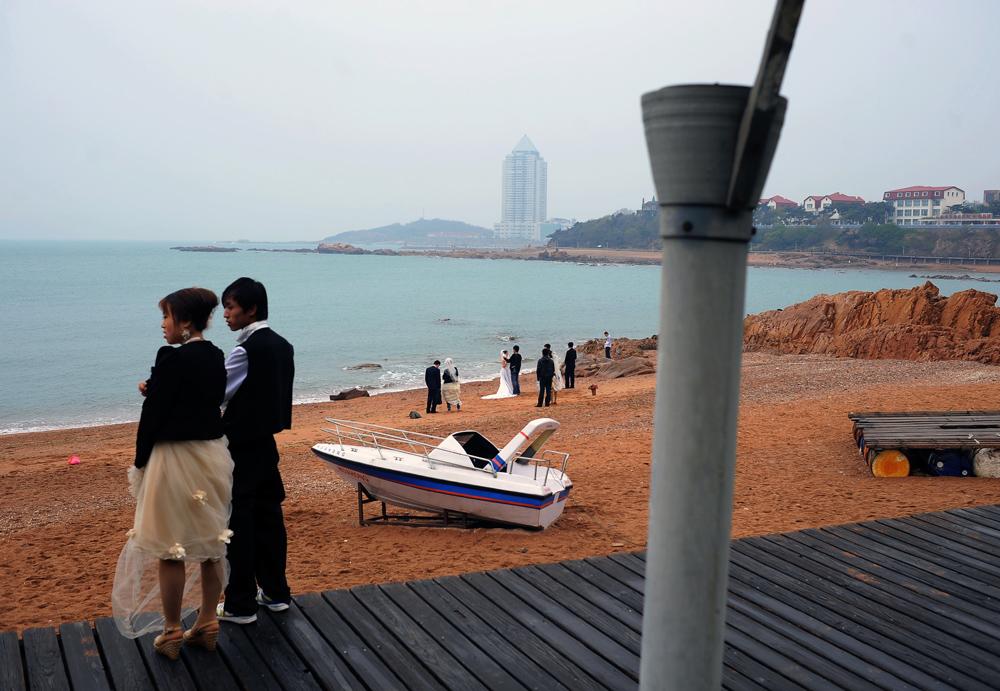 Newly-wed couples for massive photo shoot-out, Qingdao, Shangdong province, China.