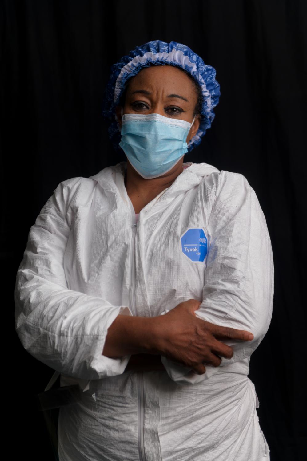Ajoke Samuel, 55, originally from Nigeria , poses for a portrait inside the COVID unit at Clove Lakes Nursing Home in Staten Island, NY where she works as a certified nursing assistant.