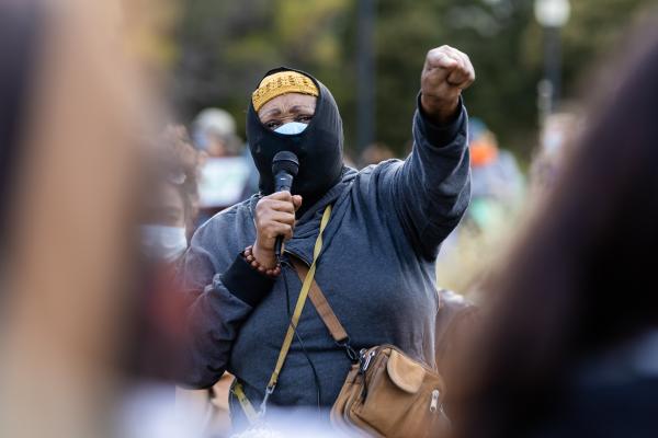 Image from Protests -  Zwazzi Solo speaks to the audience during the Women in...