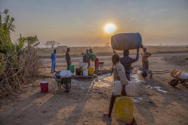 Photography - Residents of Empopini queue up for water in the...