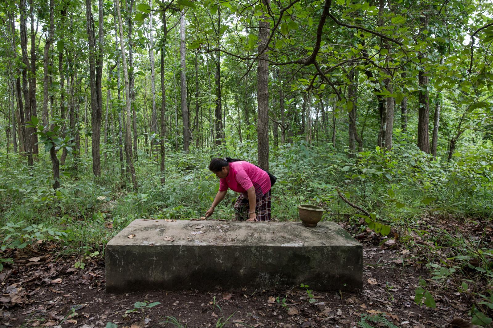 ONE LAST STAND - Sorn Khamjem, 59, cleans the area around her...