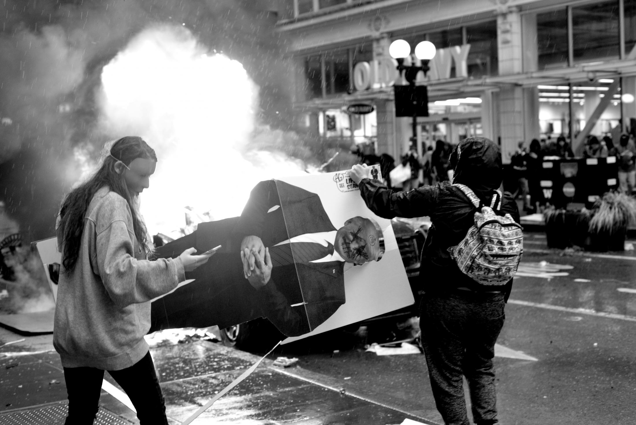 George Floyd Protests in Seattle, Washington - Protestors about to burn a life size cardboard poster of...