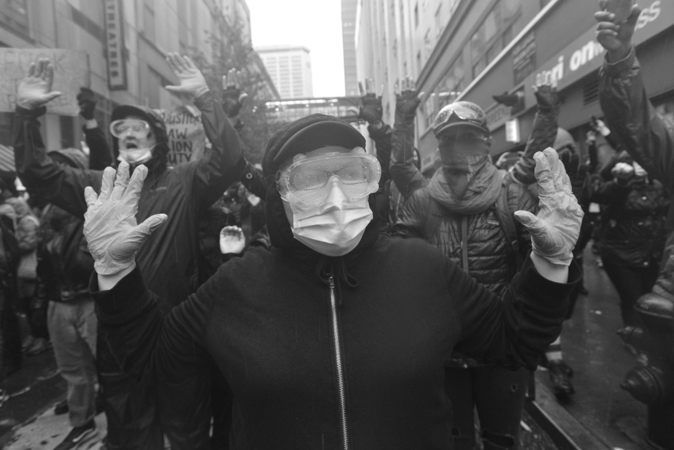 George Floyd Protests in Seattle, Washington - A protestor in Personal Protective Equipment. Despite the...