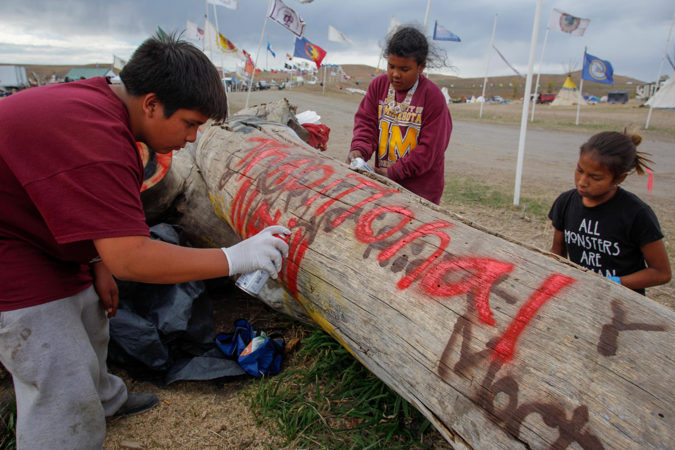 Decolonizing Water - From left to right: Hunter, 12, Rayna, 10, and Frankie,...