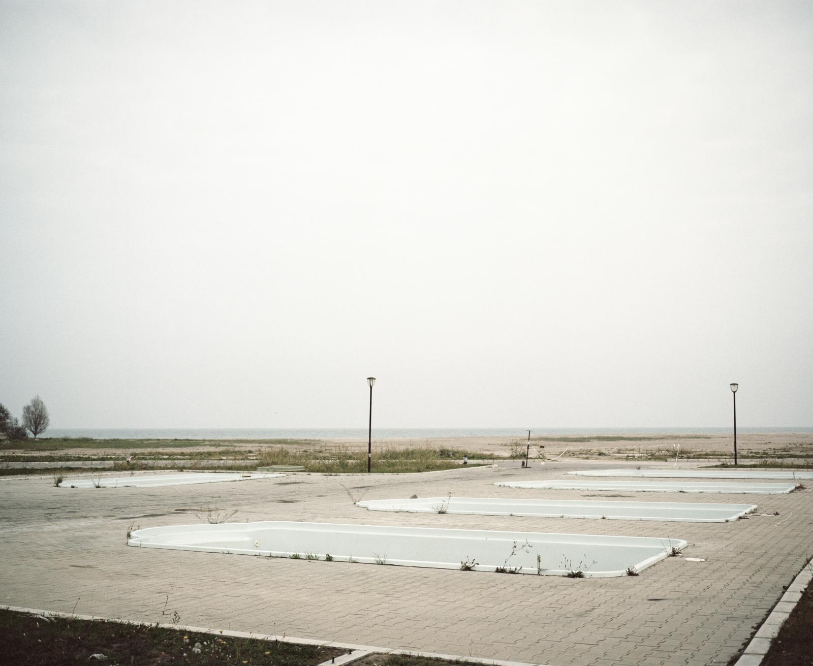 The Danube Isn't Blue - Romania, Eforie Nord. Empty swimming pools in a Black Sea...