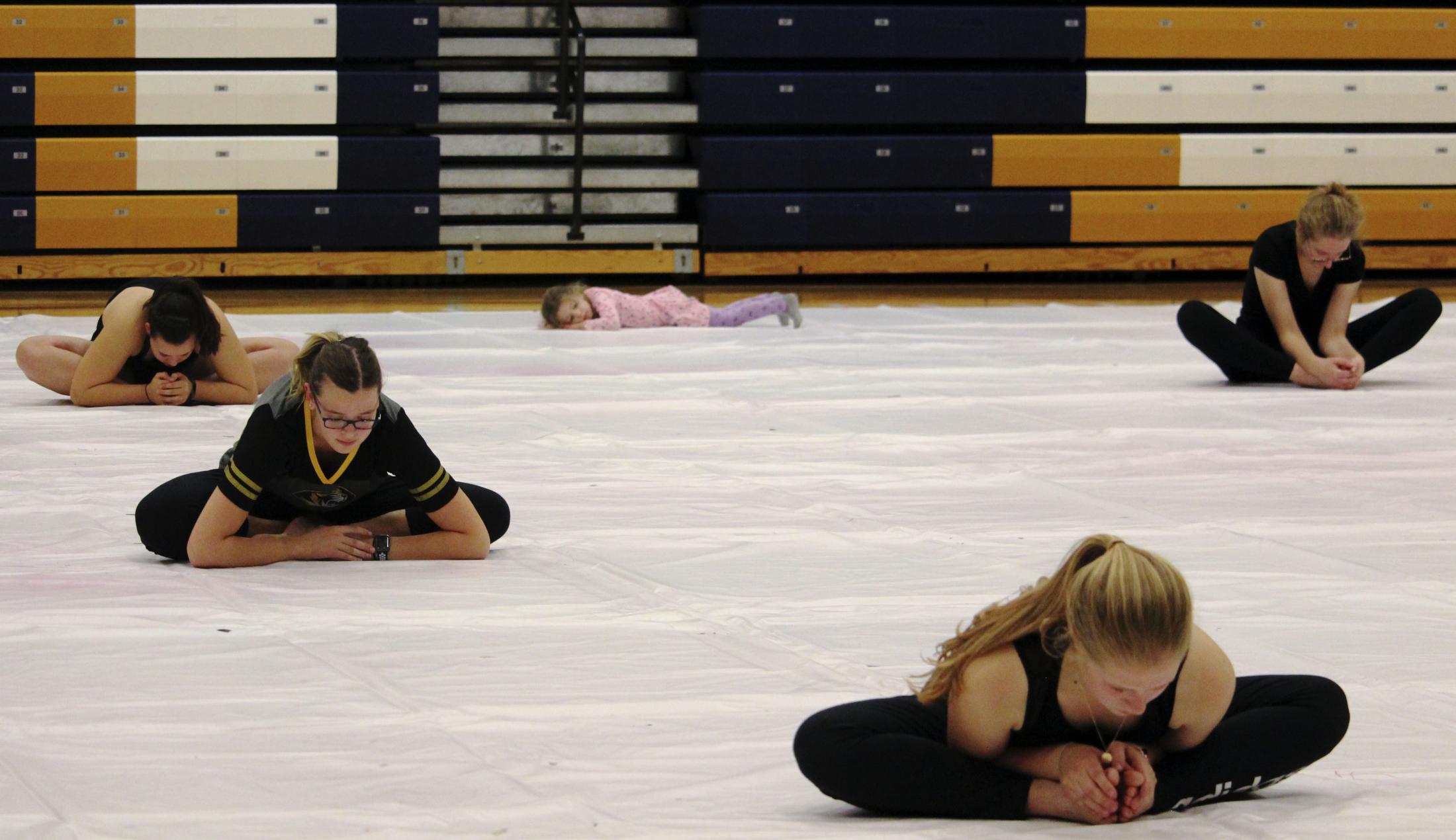 Spinning Connections - Members of the Ionic Independent winter guard stretch on...