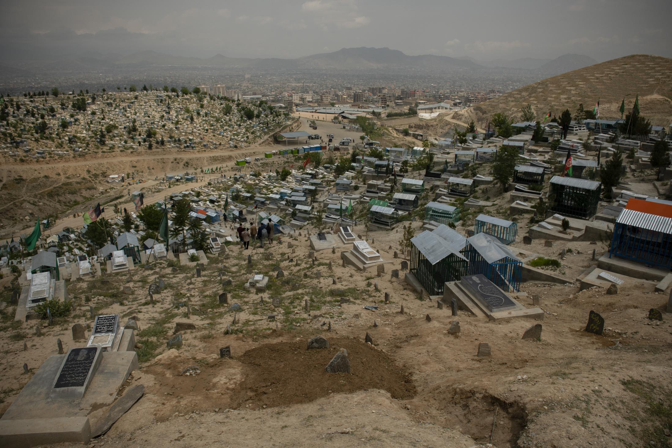 KABUL | KABUL | AFGHANISTAN | 5/13/20 | The newly dug grave where Hajar and her baby were buried earlier that morning, stands on top of a hill in a...