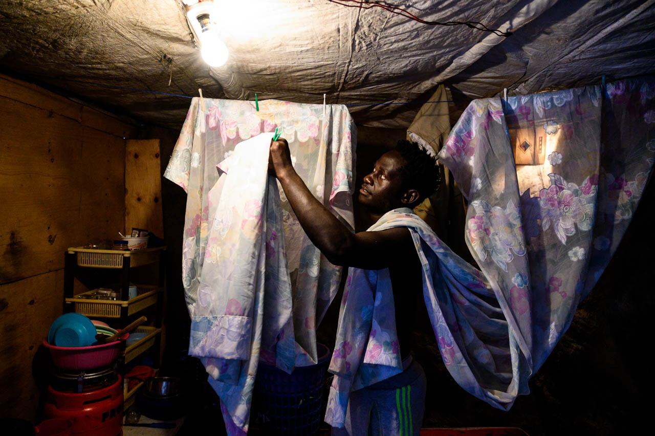 Gordwin Odhiambo | Reinventing and Adapting Through Coronavirus - Athlete Clinton Otieno, 20, prepares his house after a...