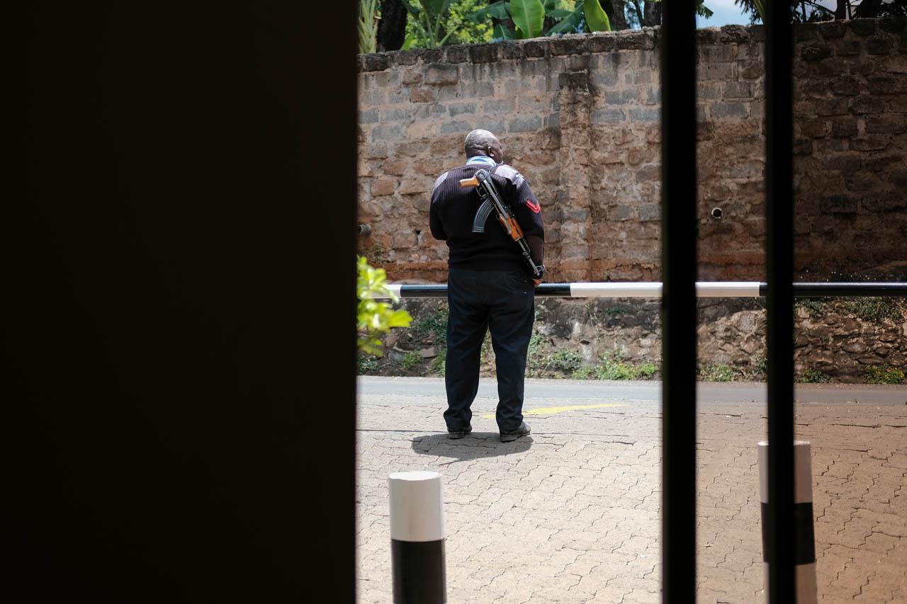 Kabir Dhanji | COVID-19 Quarantine Nairobi - An armed policeman is posted outside a Government...
