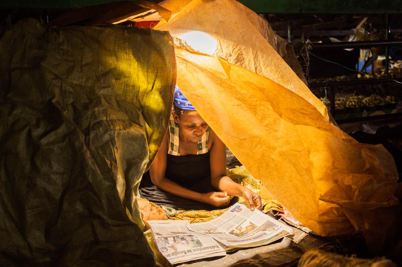 Katumba Badru | Sleeping at the Market - Gertrude, 44, also known as Mama Obama, a vendor working...