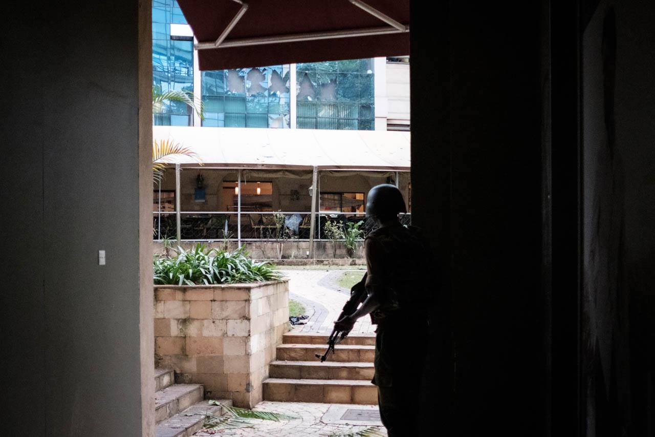Kabir Dhanji | Nairobi DusitD2 Hotel Attack - A member of the Kenyan security forces surveys the...