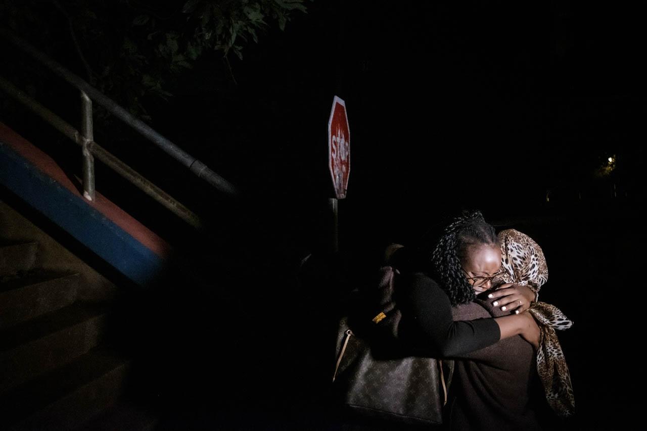 Kabir Dhanji | Nairobi DusitD2 Hotel Attack - A woman cries as she is reunited with family after being...