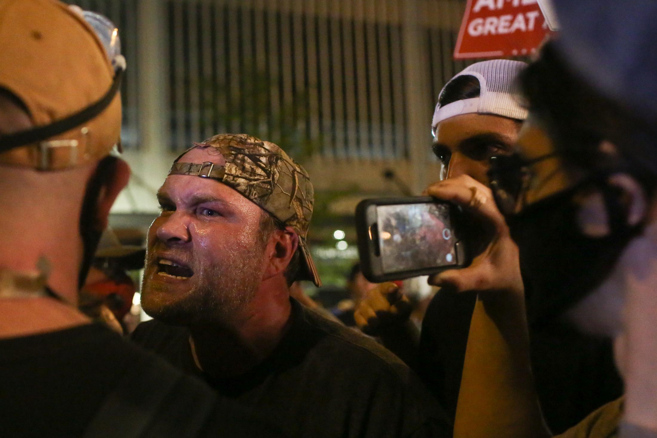 Waiting for Trump -  A supporter of Donald Trump yells at a protester during...