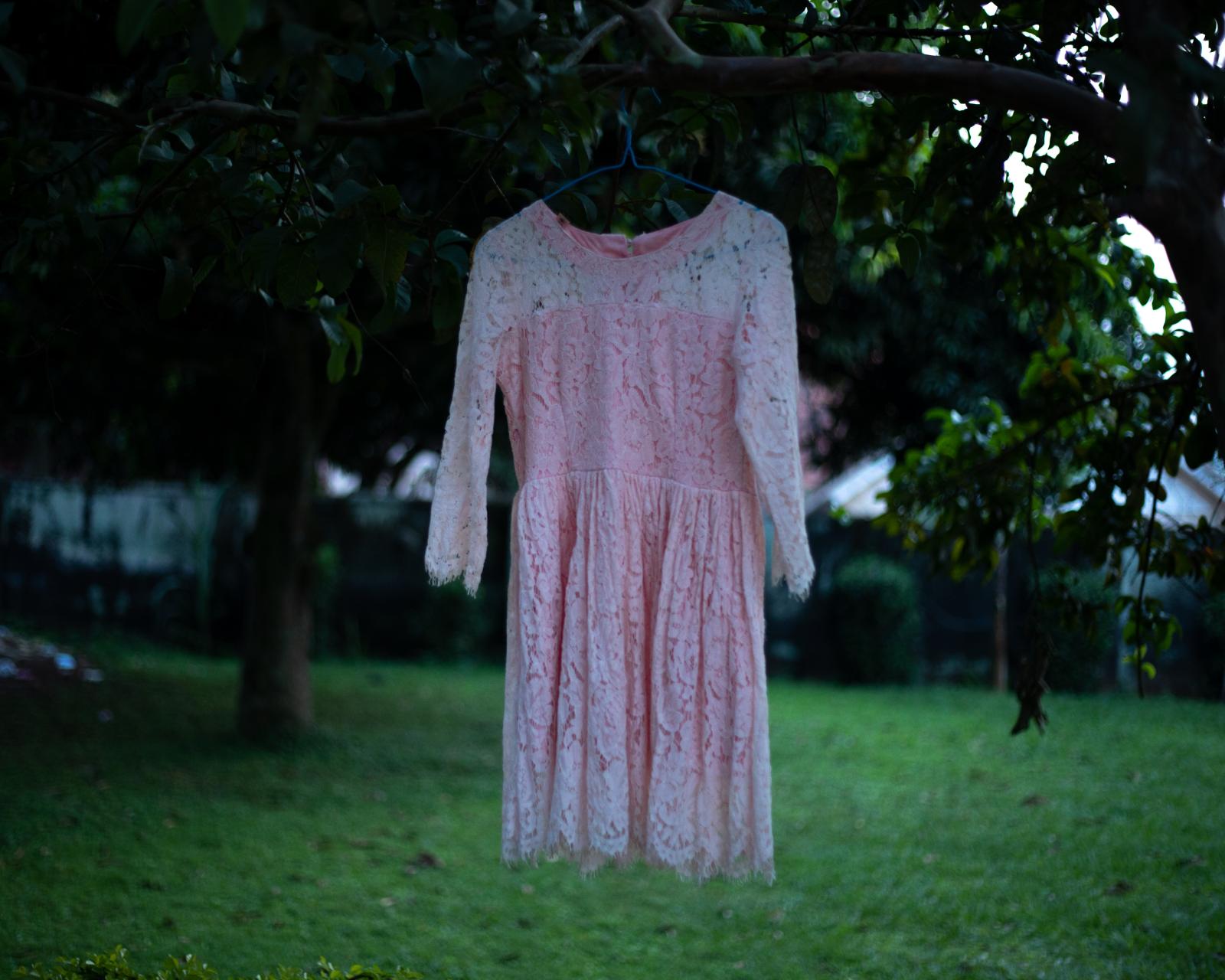 Image from Surviving Bery: A Girlhood Trauma | DeLovie Kwagala  - “I feel like a grown up wearing this dress. He...