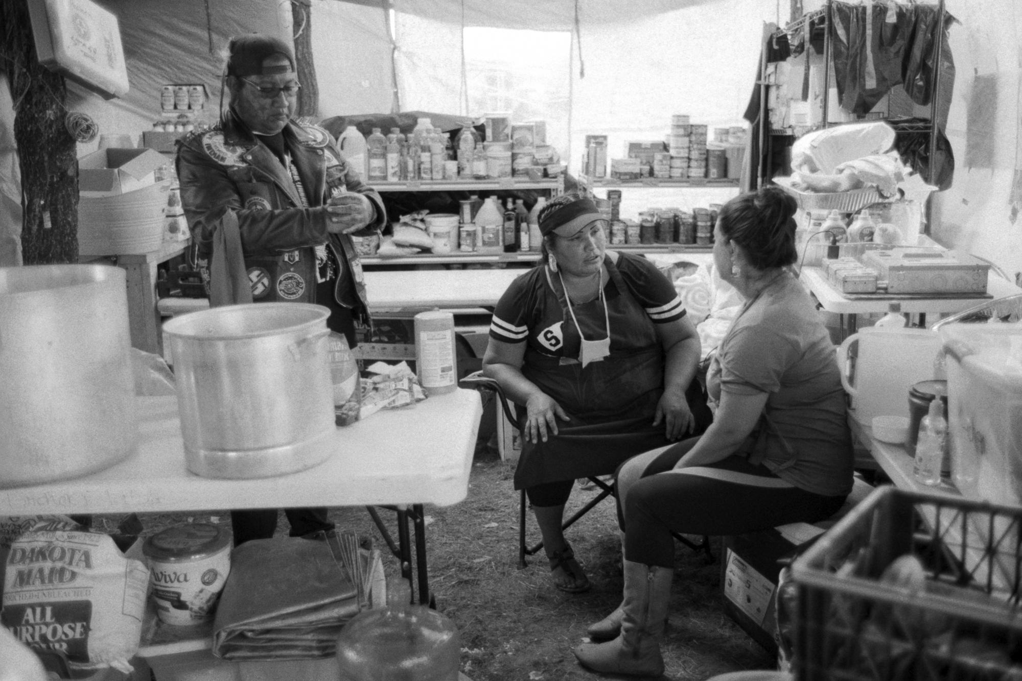 Standing Rock - Kitchen workers take some downtime between meals in the...