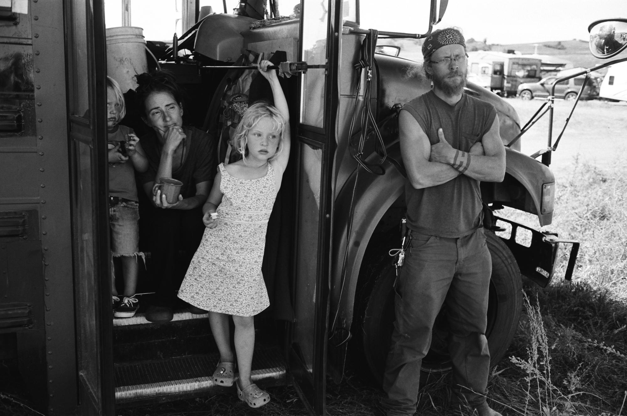 Standing Rock - An ally family of four in front of their school bus,...