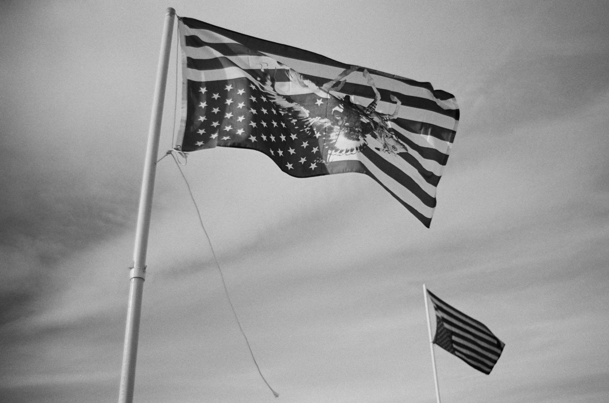 Standing Rock - Two inverted flags fly above the main Oceti Sakowin Camp...