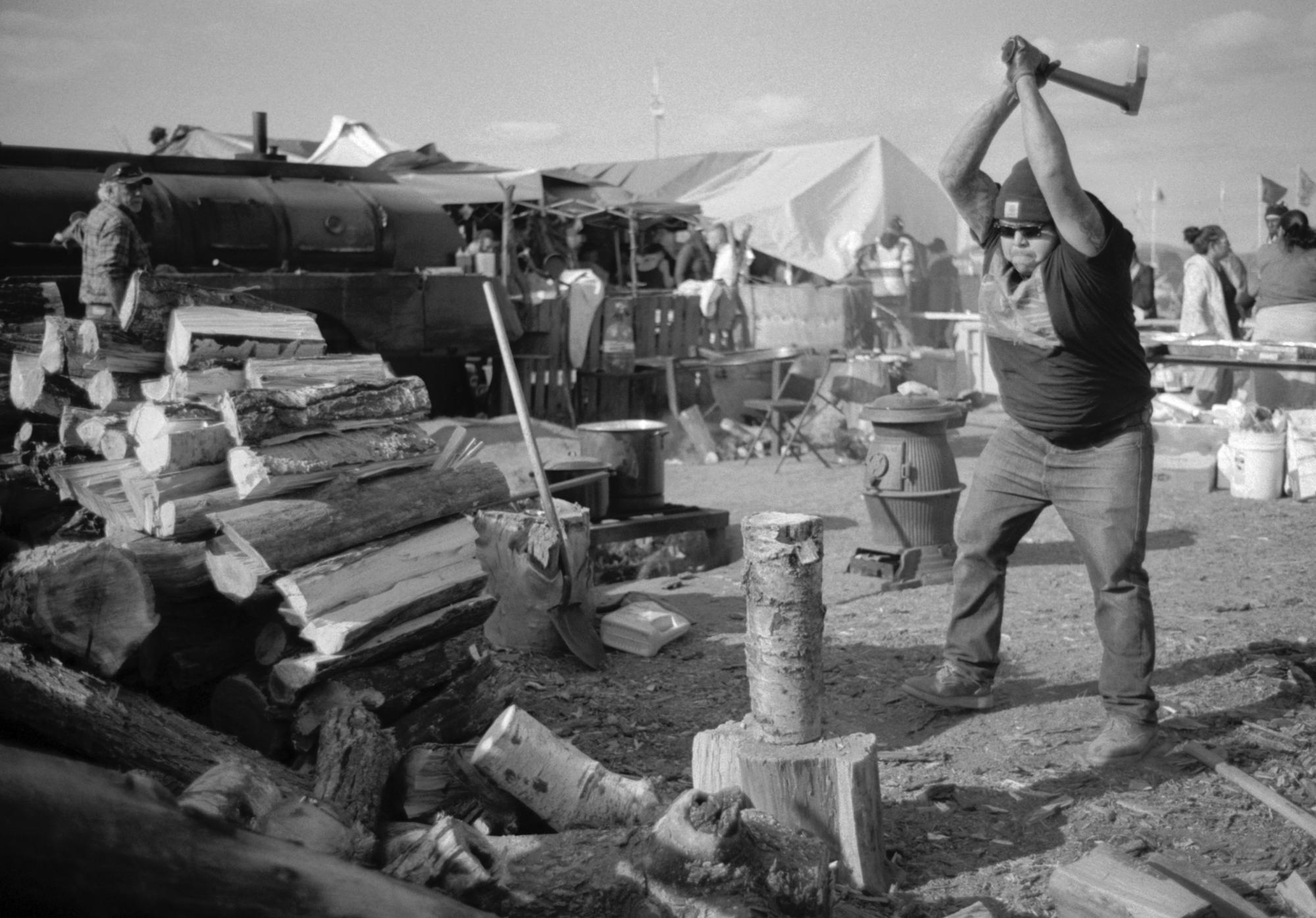 Standing Rock - Chopping wood near the main kitchen of the Oceti Sakowin...