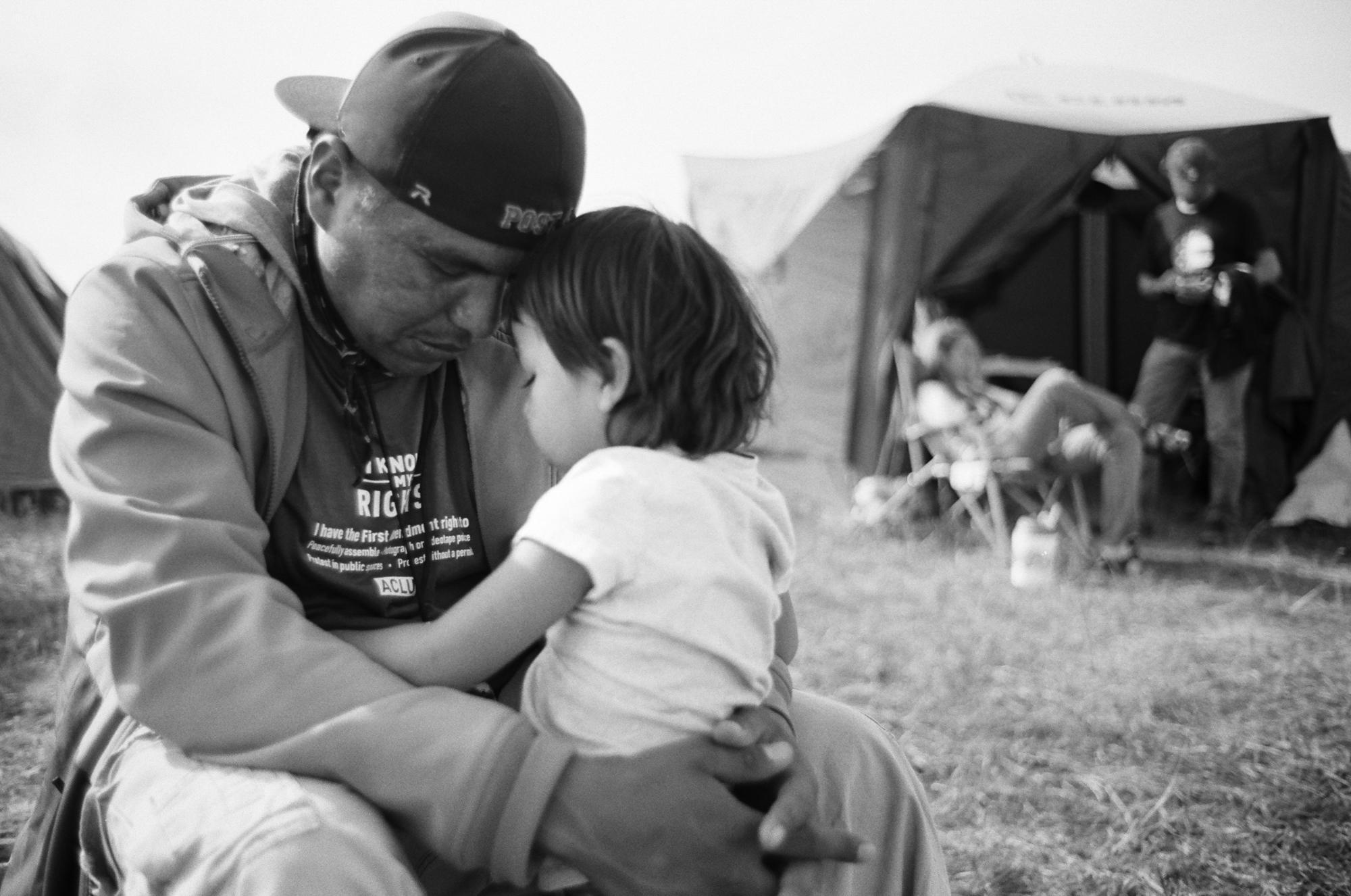 Standing Rock - Dean Dedman Jr. with his daughter, up on "Media...
