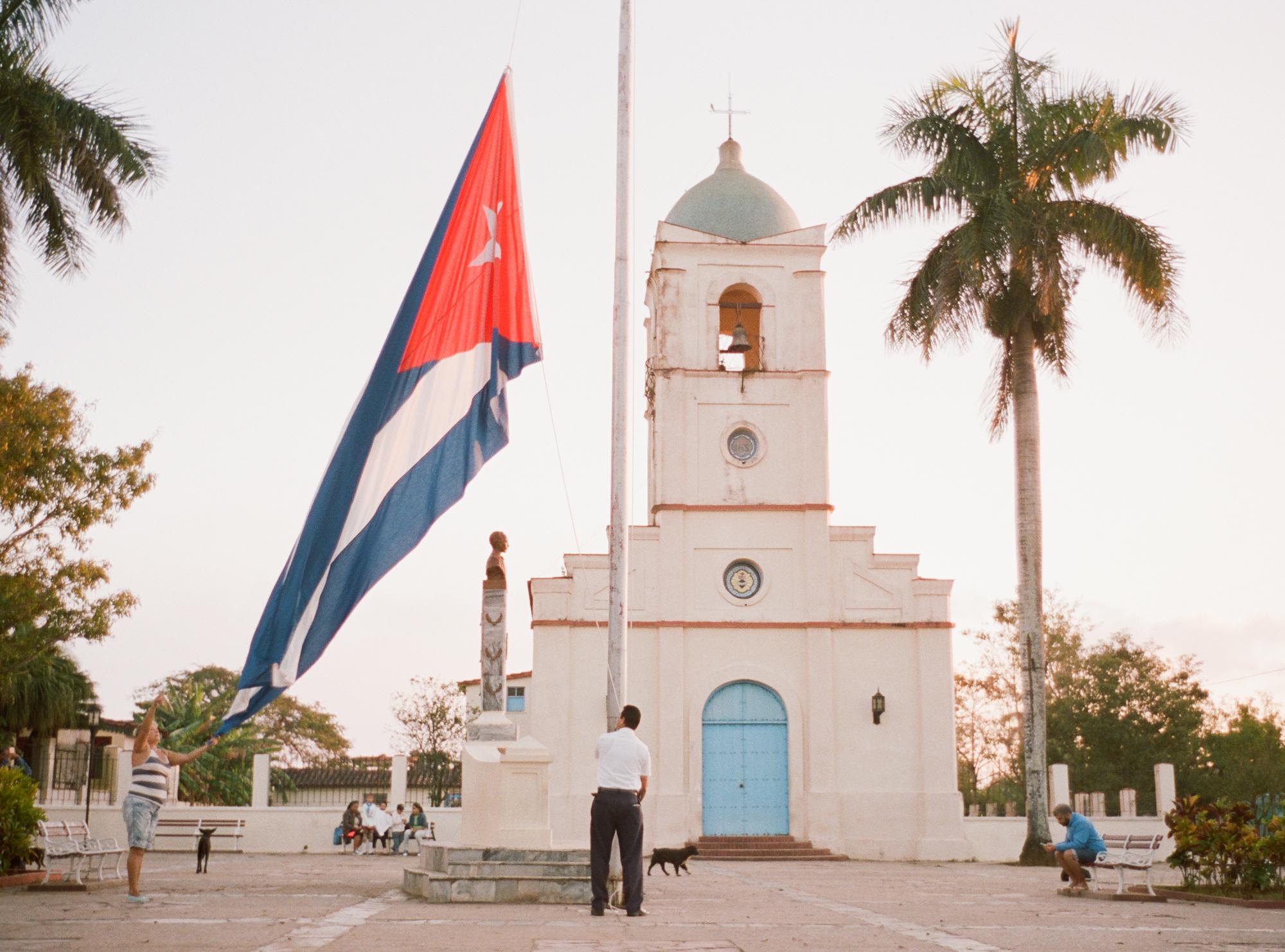 Tobaccoland - VIÑALES.  As the sun rises, so does the Cuban flag...