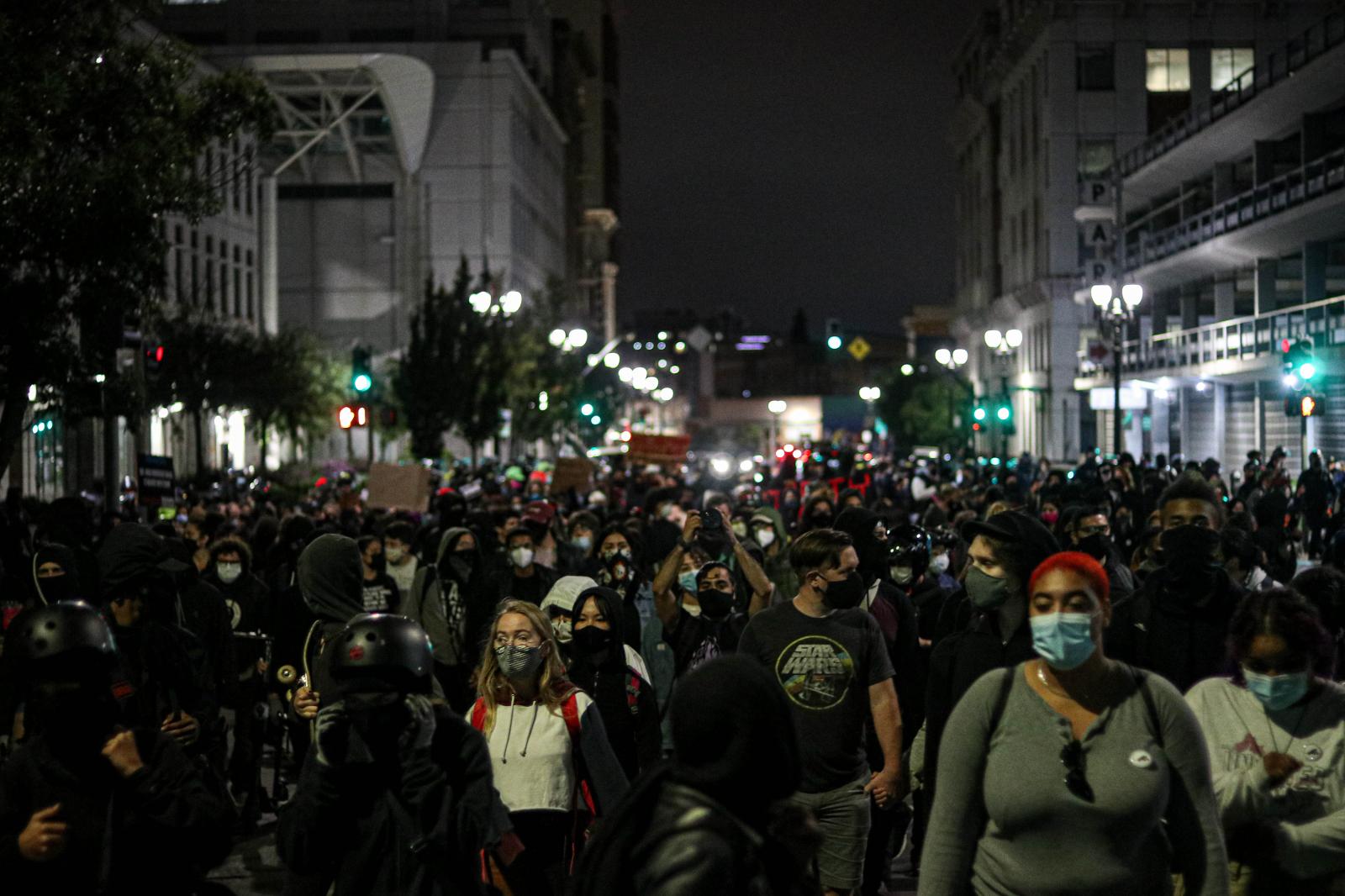 Protesters march on the streets...Oakland, Calif., Aug. 28, 2020)