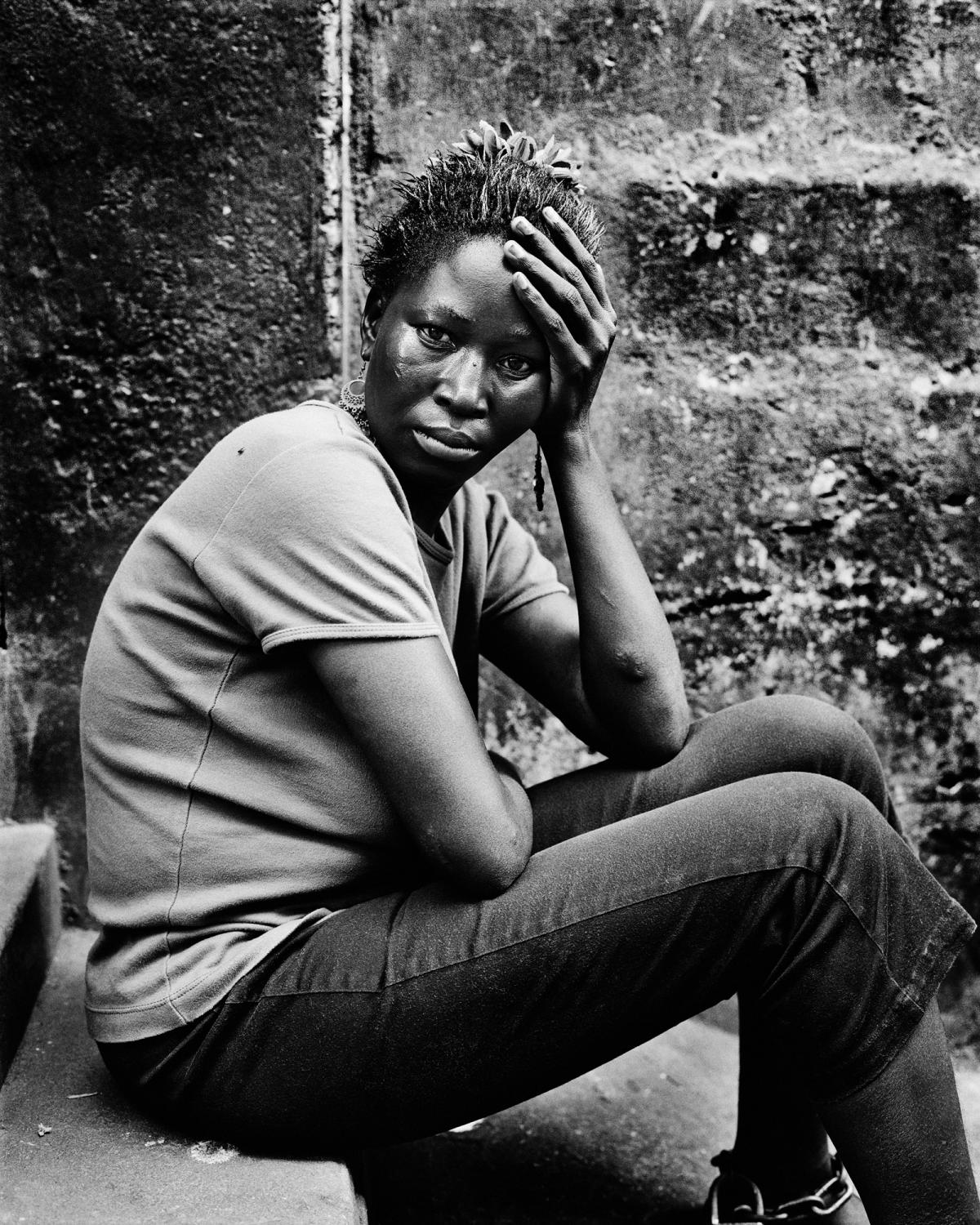 City of rest - SIERRA LEONE Freetown. August 2007. Portarit of a chained...