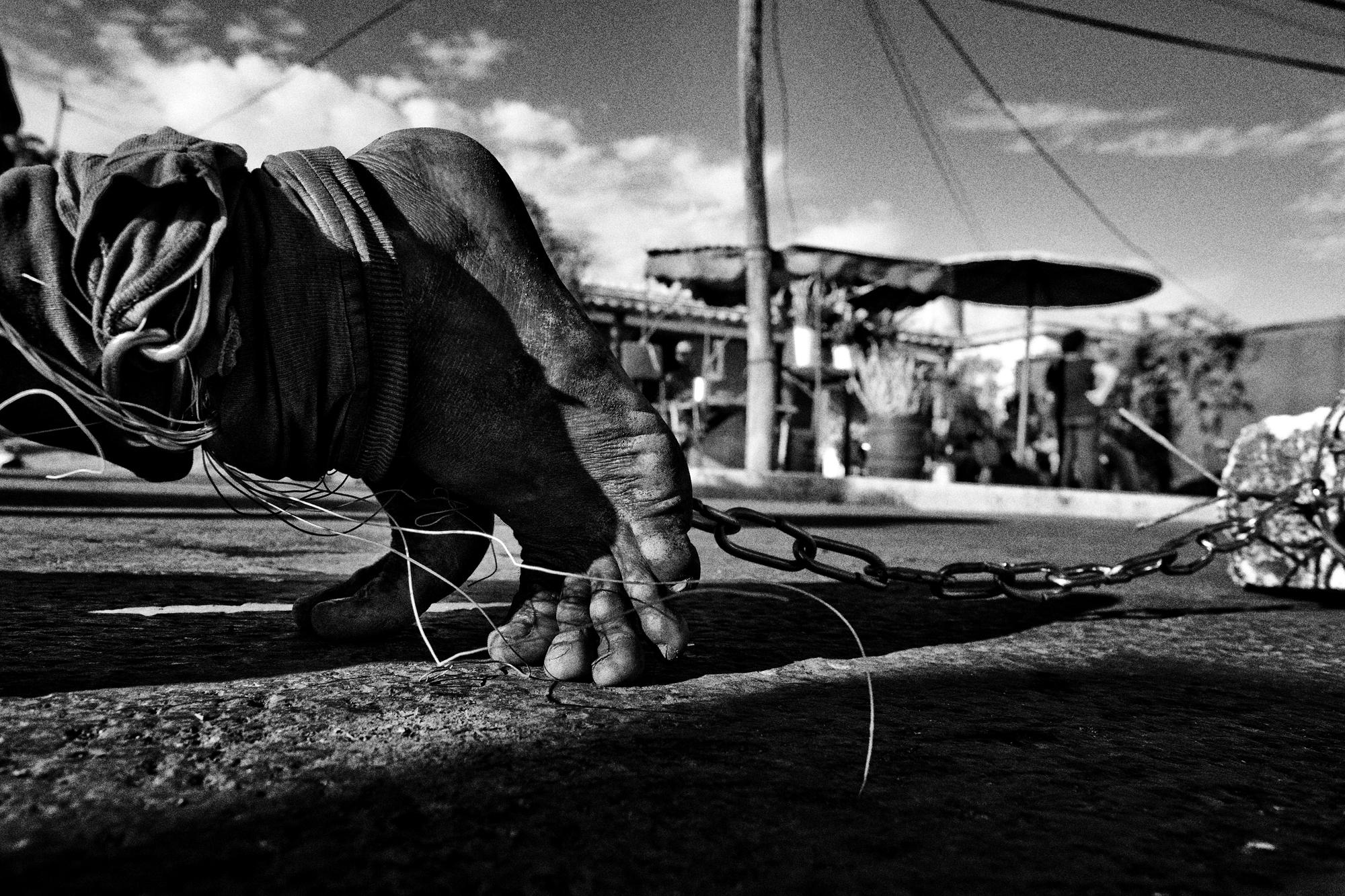 San Lázaro  - Cuba, El Rincon (Santiago de la Vega). A pilgrim crawling...