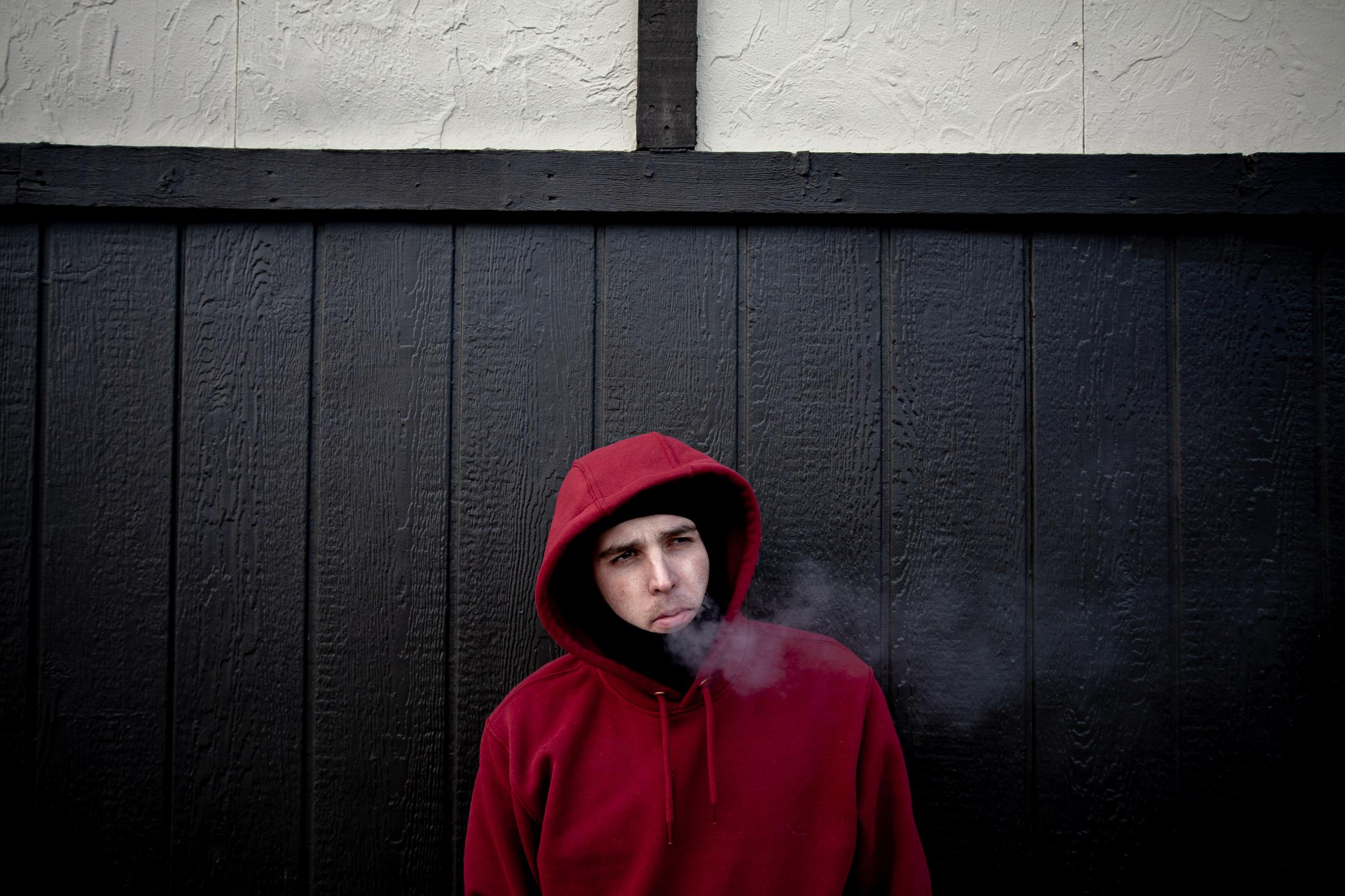 2/5/14- North Dakota - Adam Braum, 26, stands outside his hotel room that he has been sent to by...