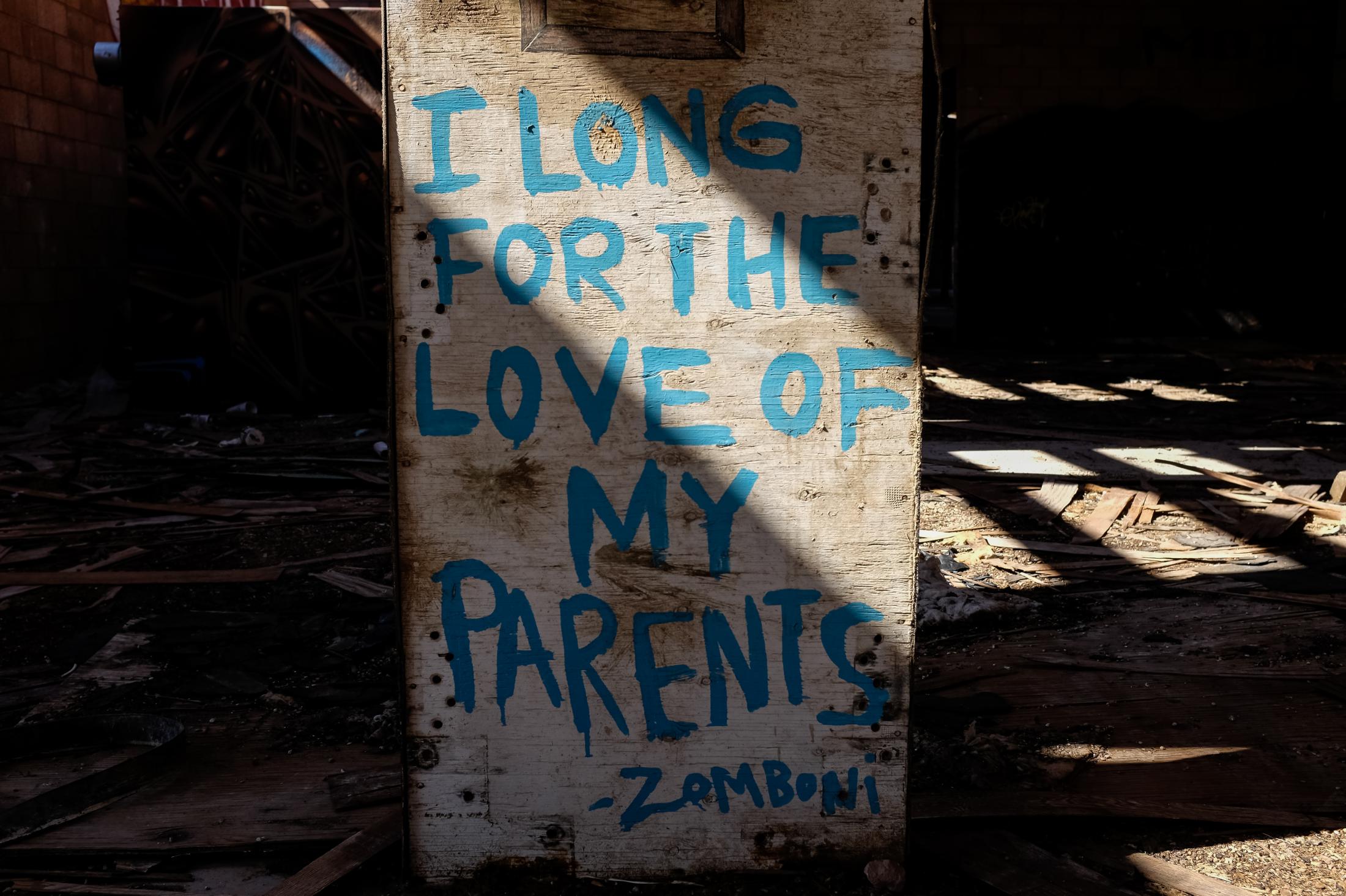 Graffiti that has been left behind on a concrete pillar, expresses pain from the past. Many...